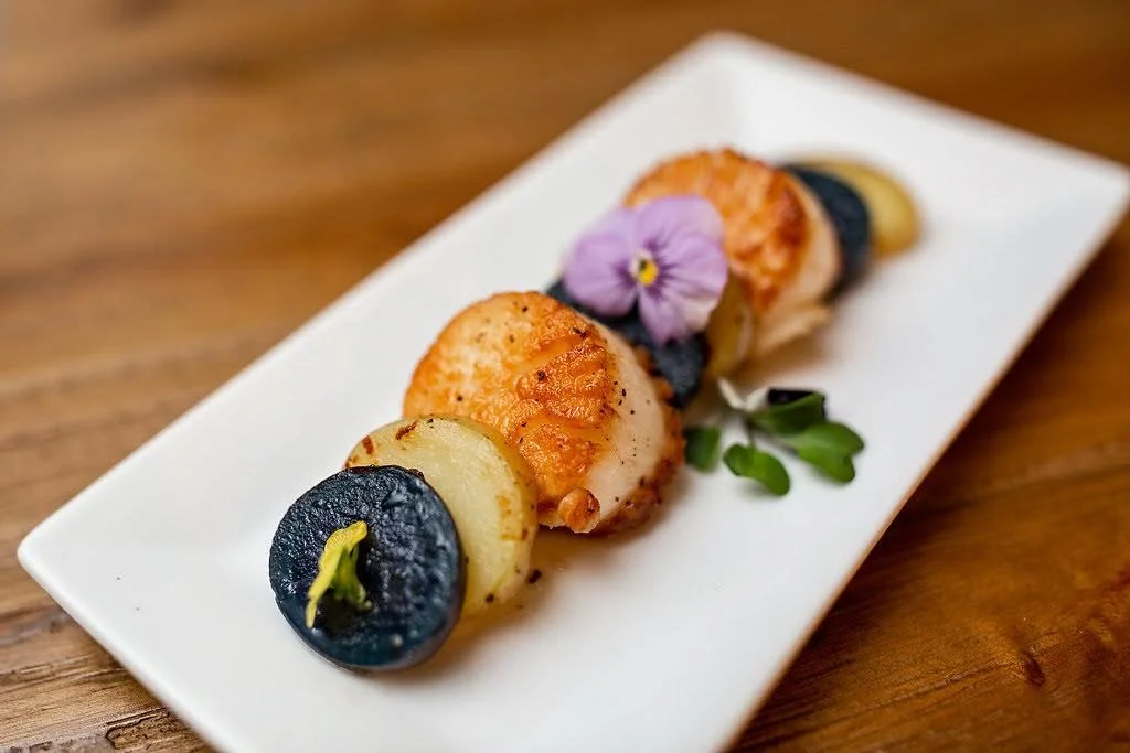 Simple ingredients. Exceptional execution.

Perfectly seared scallops paired with seasonal accompaniments and finished with delicate touches that make every plate feel like a special occasion.

Because luxury isn't about being complicated.
It's about