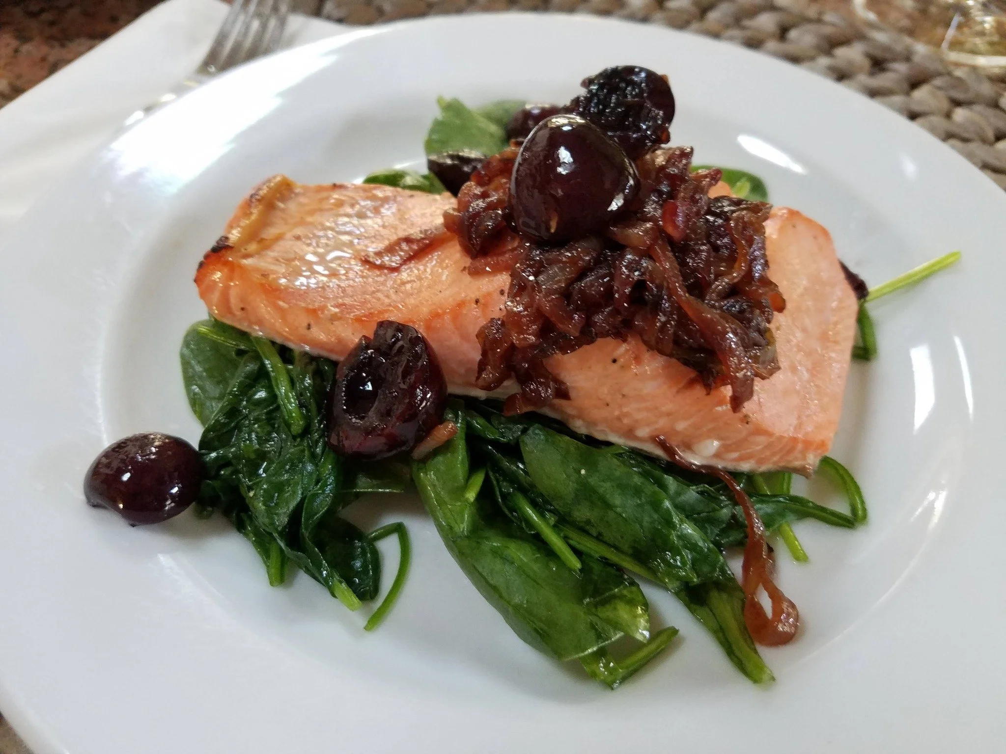 When comfort food meets elevated dining.

Beautifully cooked salmon served over fresh spinach and topped with sweet caramelized onions and cherries for a rich, flavorful finish.

A dish that feels elegant enough for a celebration and comforting enoug