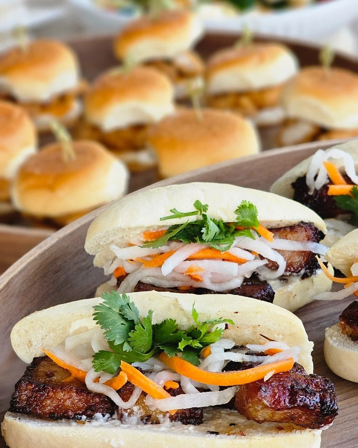A Slider Station, but make it fancy...

Soft steamed buns. Crispy pork belly. Bright pickled vegetables. 

Every bite delivers the perfect combination of savory, sweet, tangy, and fresh.

Because your event menu deserves something guests will actuall