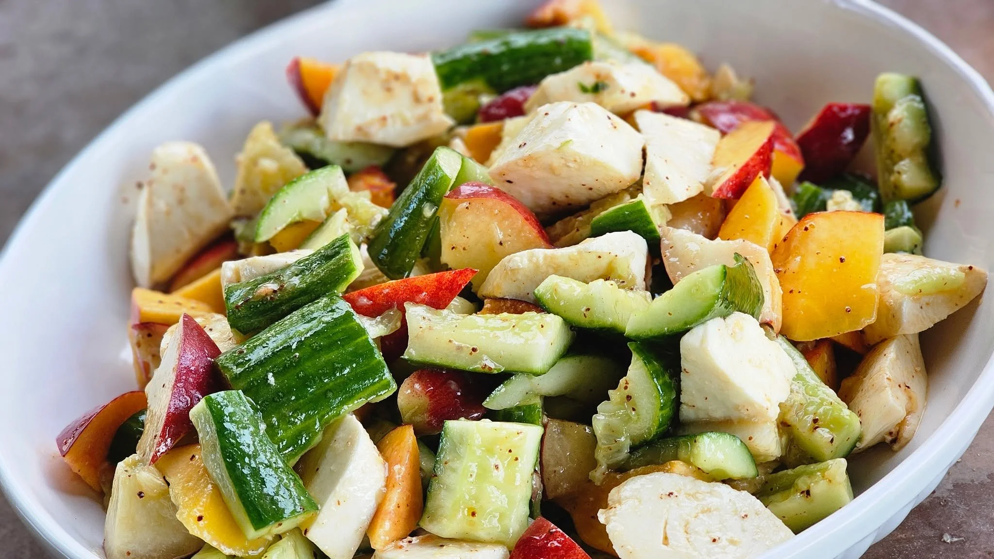 Summer Fruit &amp; Mozzarella Salad

Fresh ingredients don't need to be complicated.

Sweet seasonal fruit, crisp cucumber, and creamy mozzarella come together in a refreshing salad that's perfect for weddings, private dinners, and summer celebration