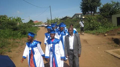 Sewing Center Graduates with the teacher of tailoring, Desire.