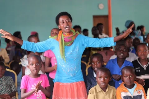 Choir director for the community children in action.