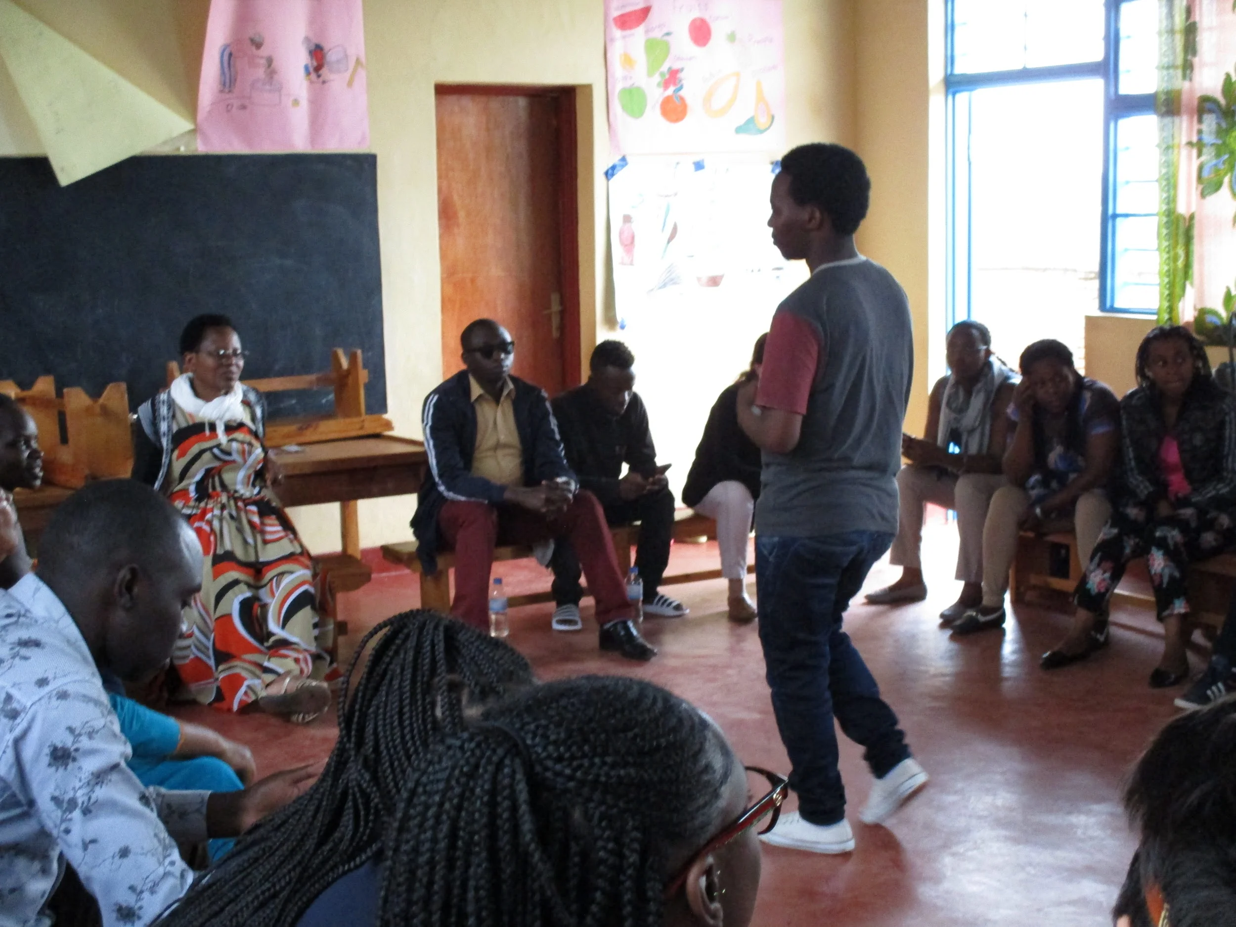 Buffalo student/teacher Lucas and Muhanga teachers.