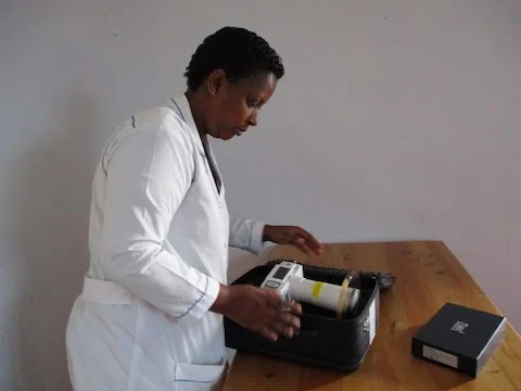 Oliver, our dental technician, opening the satchel holding the X-ray machine. What a sight to behold!