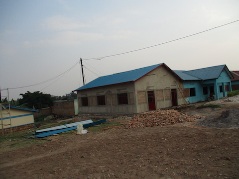 Good looking on July 25. Building with roof and ready for exterior paint.