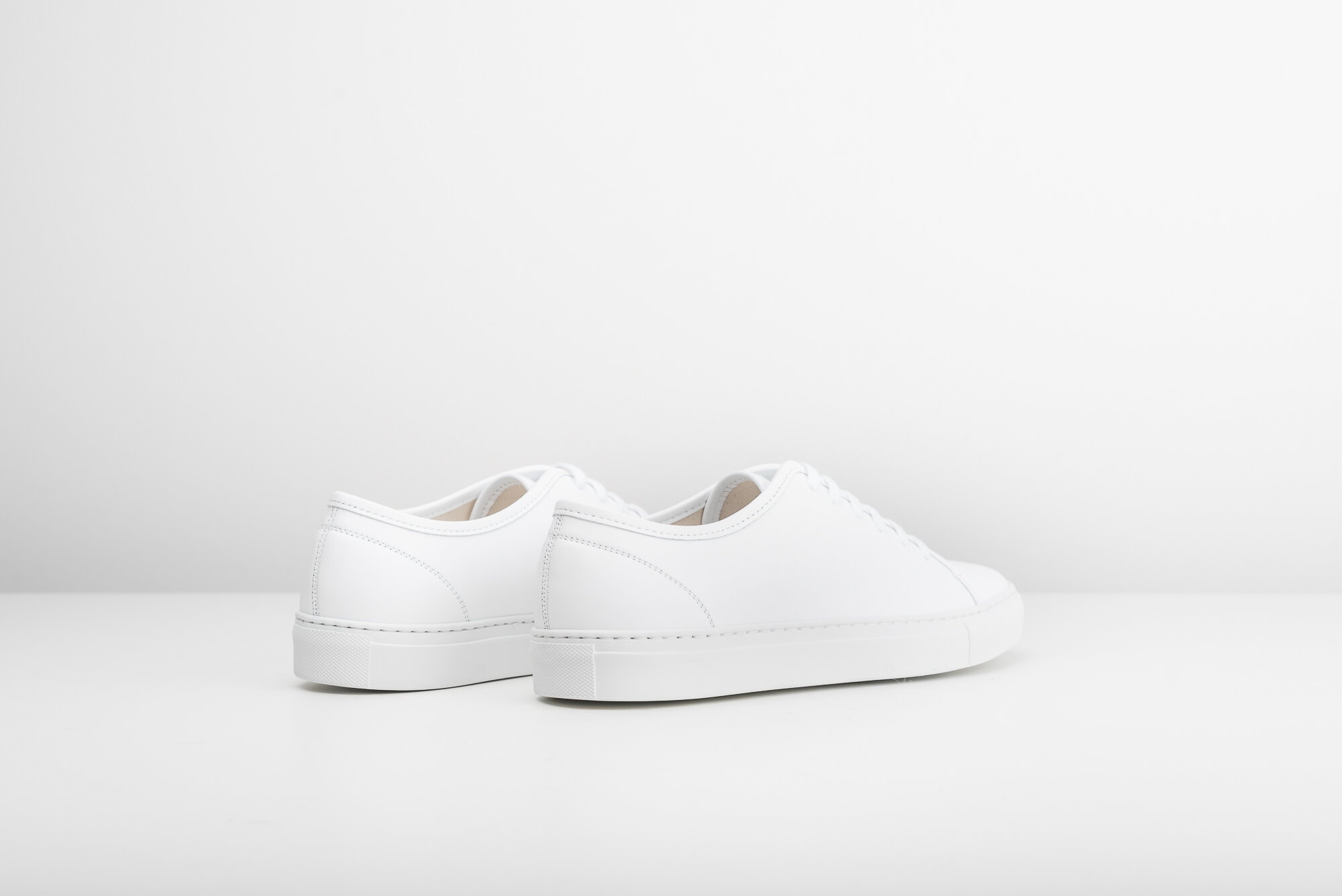 white minimal sneakers