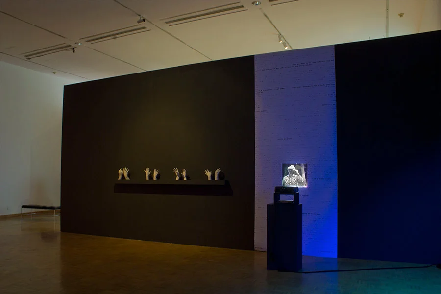 Almost Lovers Always Do. 19'W x 13'L x 1'D Digital print, projection of modified silver gelatin prints, cast plaster hands. (2012)