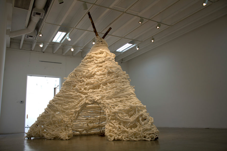  Many Truths. 192"H x 144"W x 138"D. Pine Logs, Natural Manila Rope, Tracing Paper. (2014)