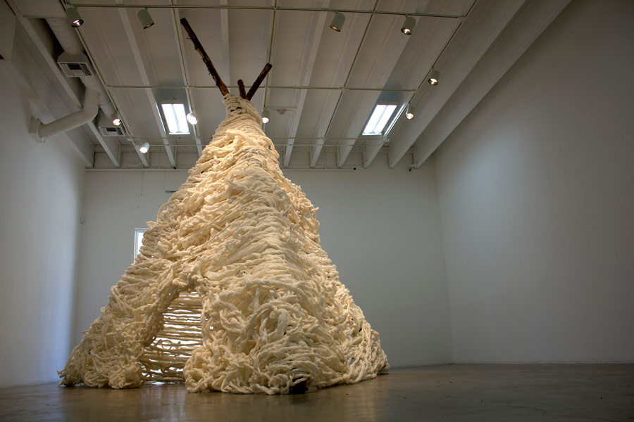  Many Truths. 192"H x 144"W x 138"D. Pine Logs, Natural Manila Rope, Tracing Paper. (2014)