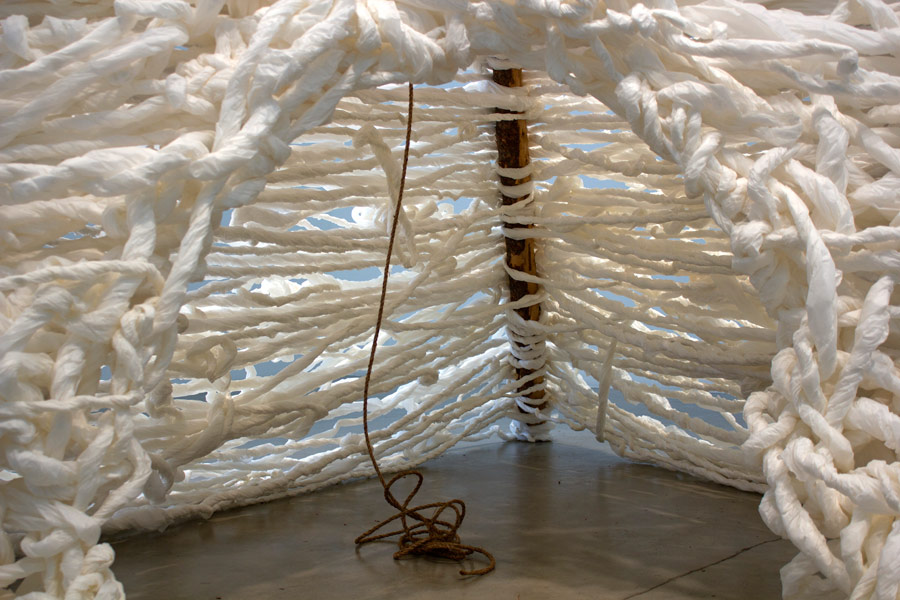  Many Truths. 192"H x 144"W x 138"D. Pine Logs, Natural Manila Rope, Tracing Paper. (2014)