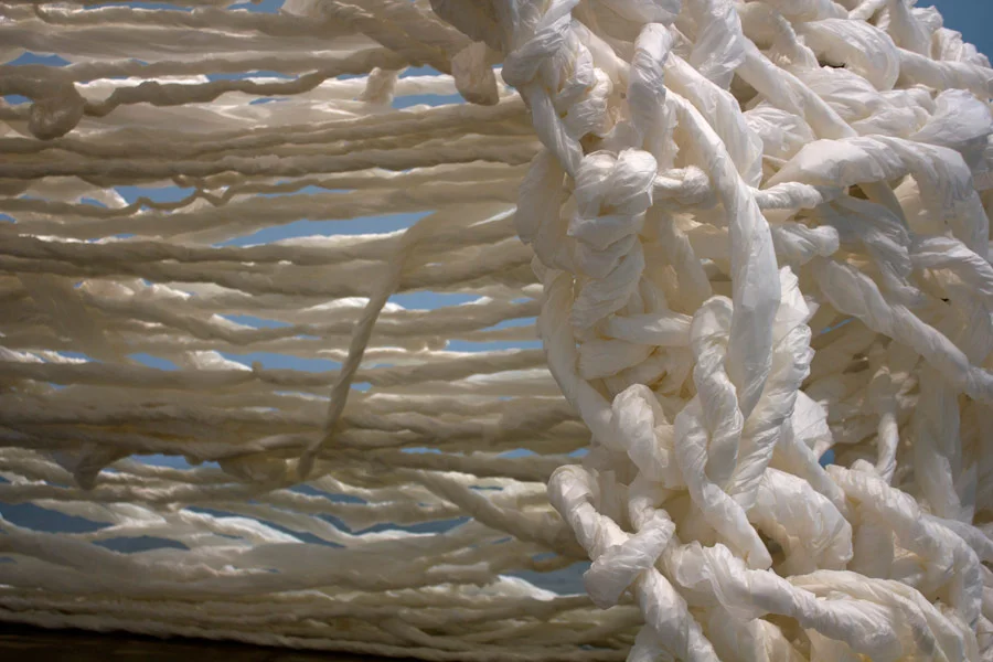 Many Truths. 192"H x 144"W x 138"D. Pine Logs, Natural Manila Rope, Tracing Paper. (2014)
