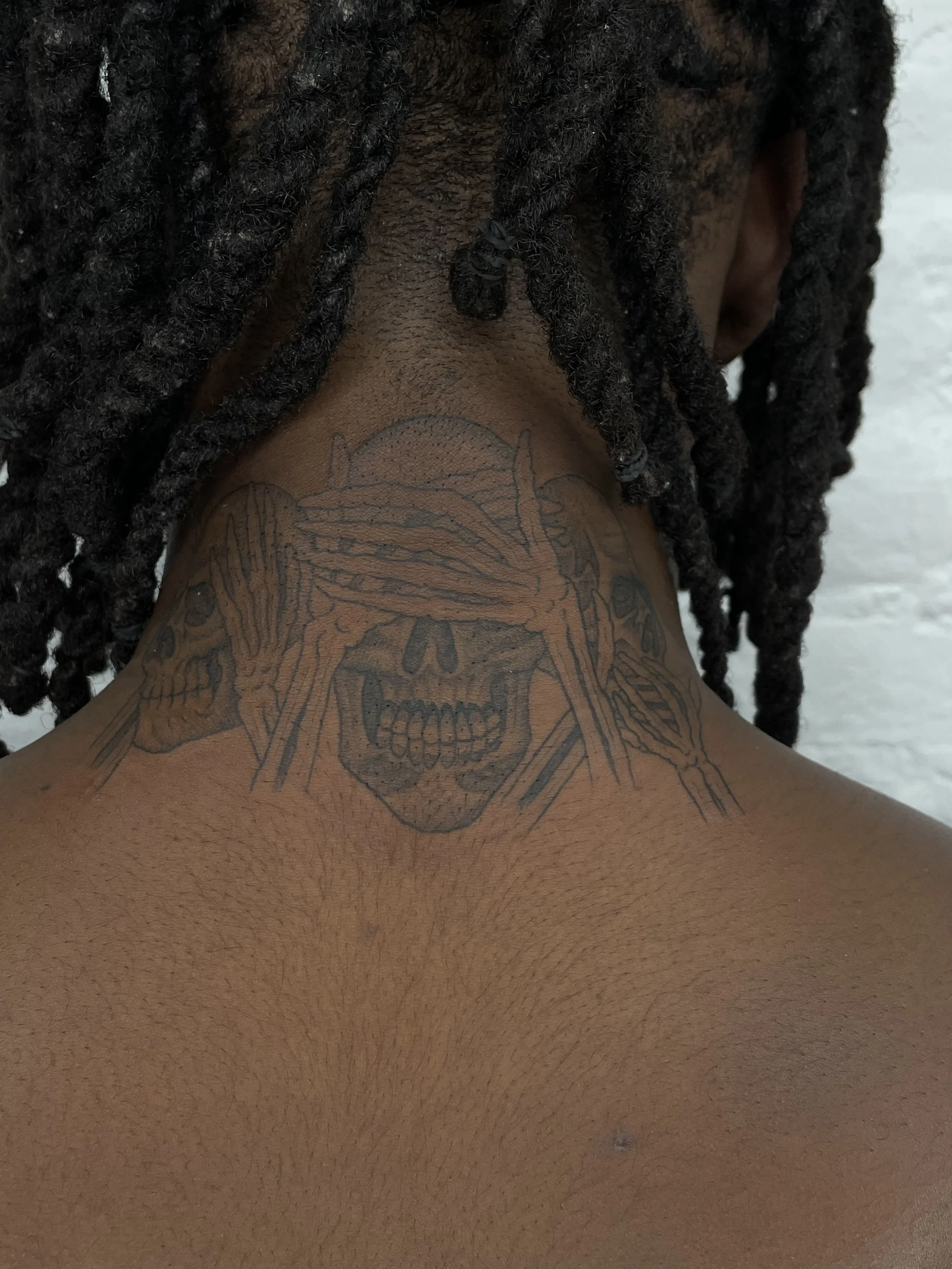 skulls on the neck tattoo for kader sylla