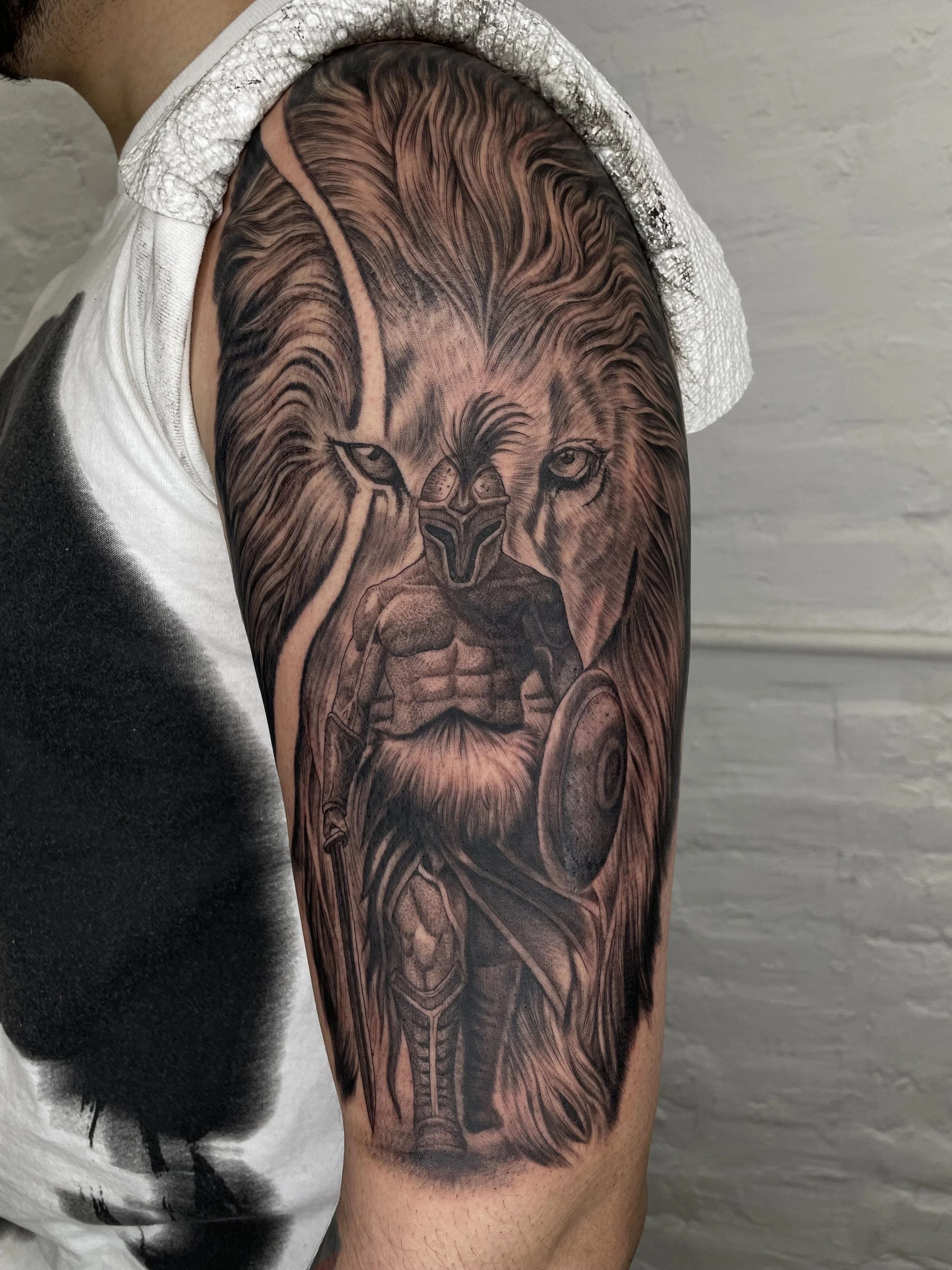 black and grey lion tattoo