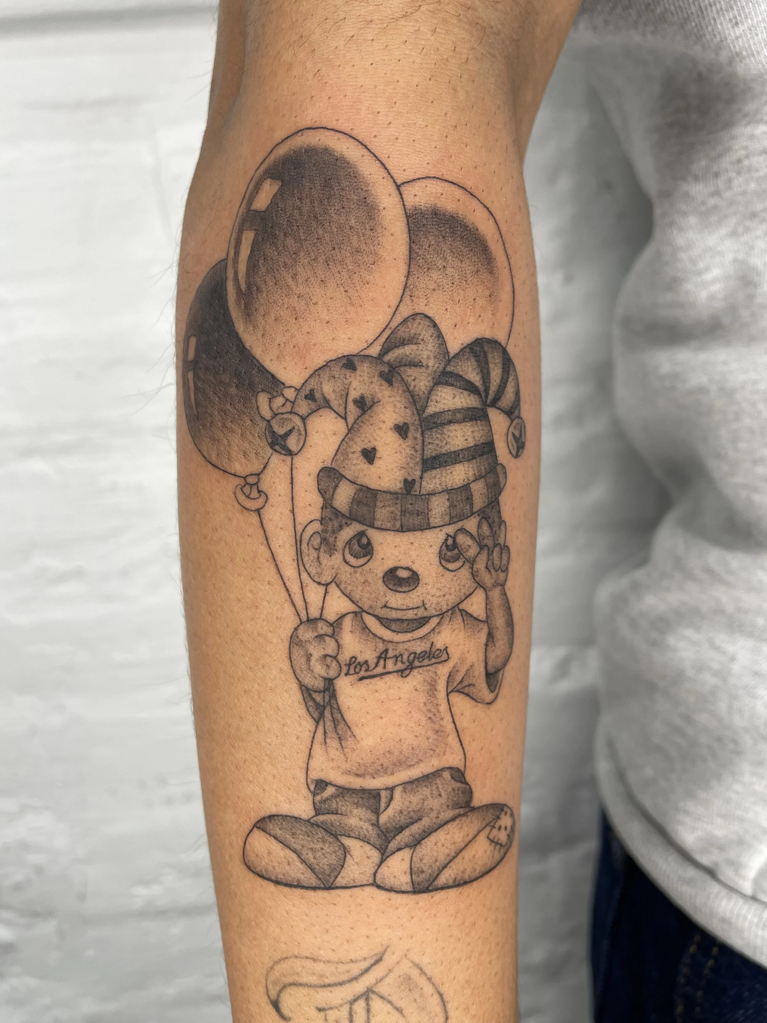 precious moments clown boy tattoo with dodgers shirt