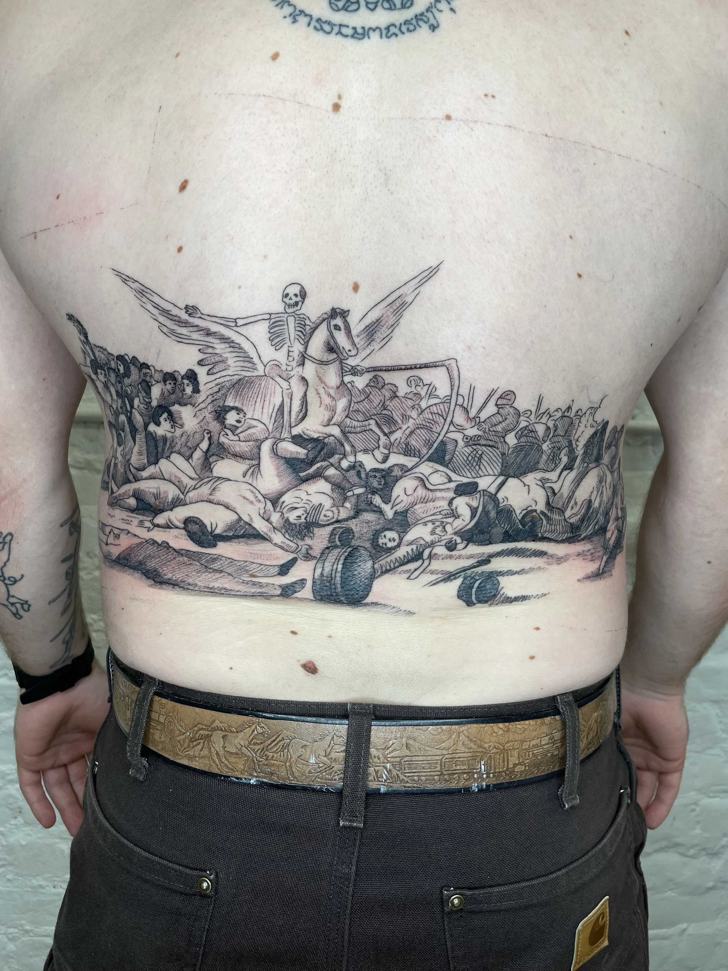 lower back tattoo with skeleton warrior