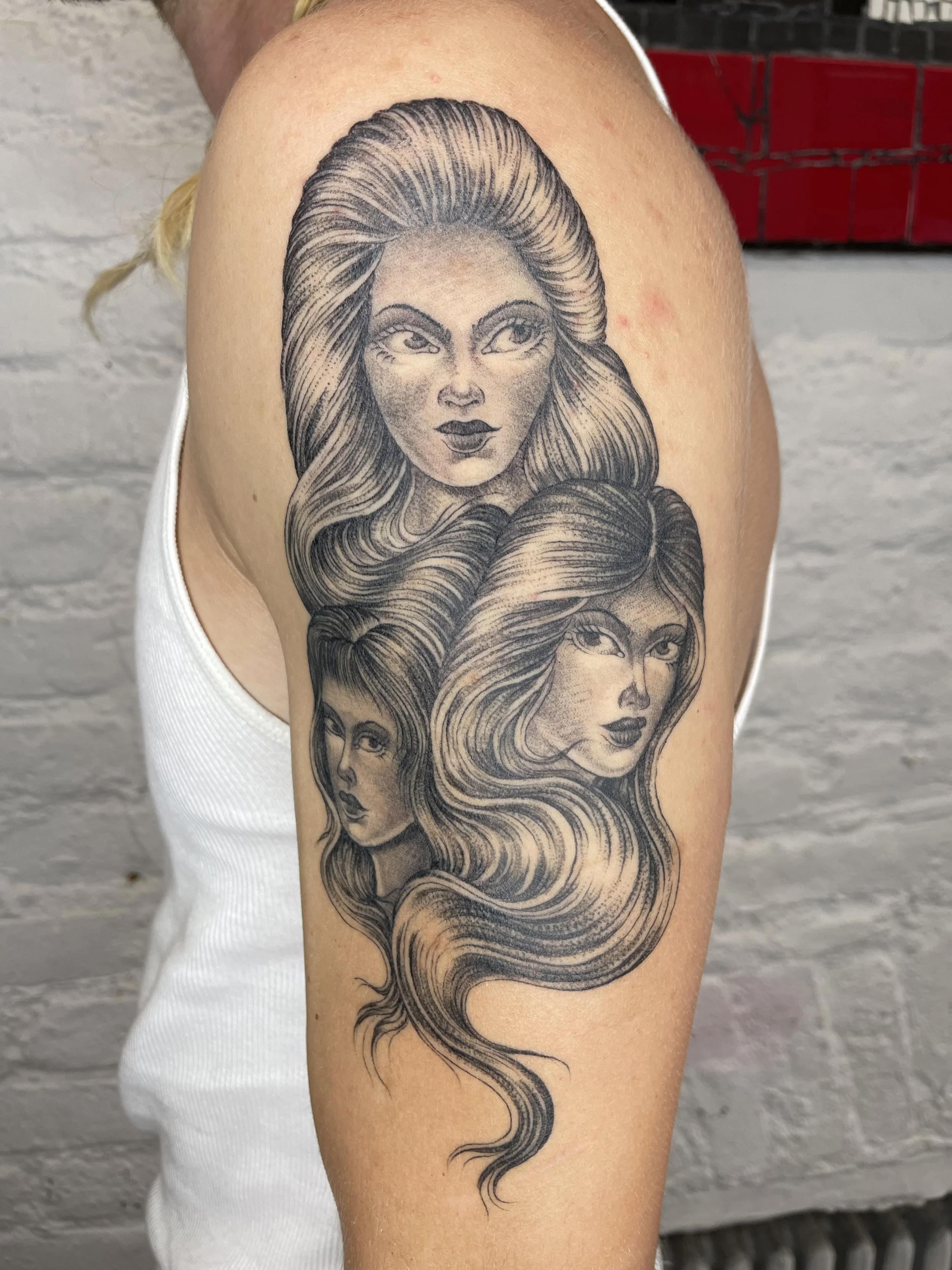 teen angel girl heads tattoo on the shoulder