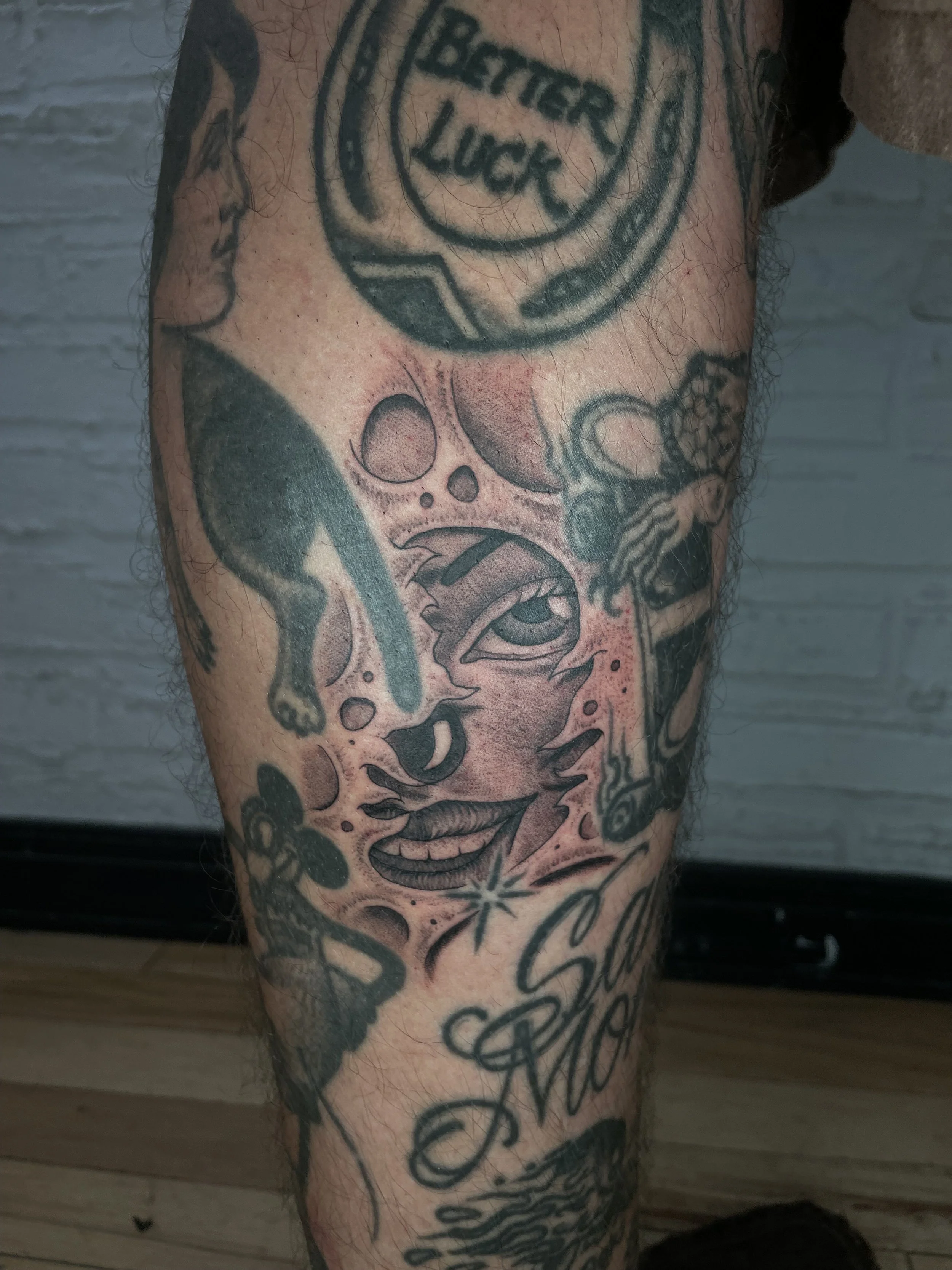 fine line black and grey clown gap filler tattoo