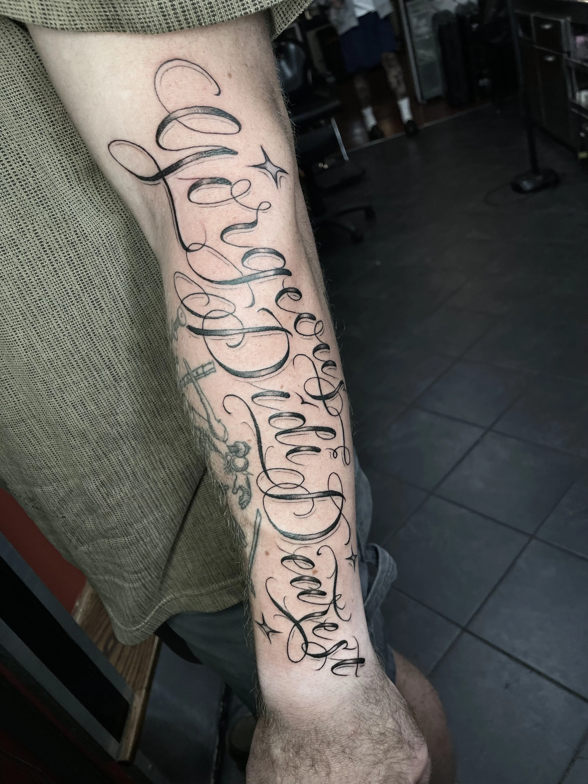letting tattoo forearm tattoo.jpeg
