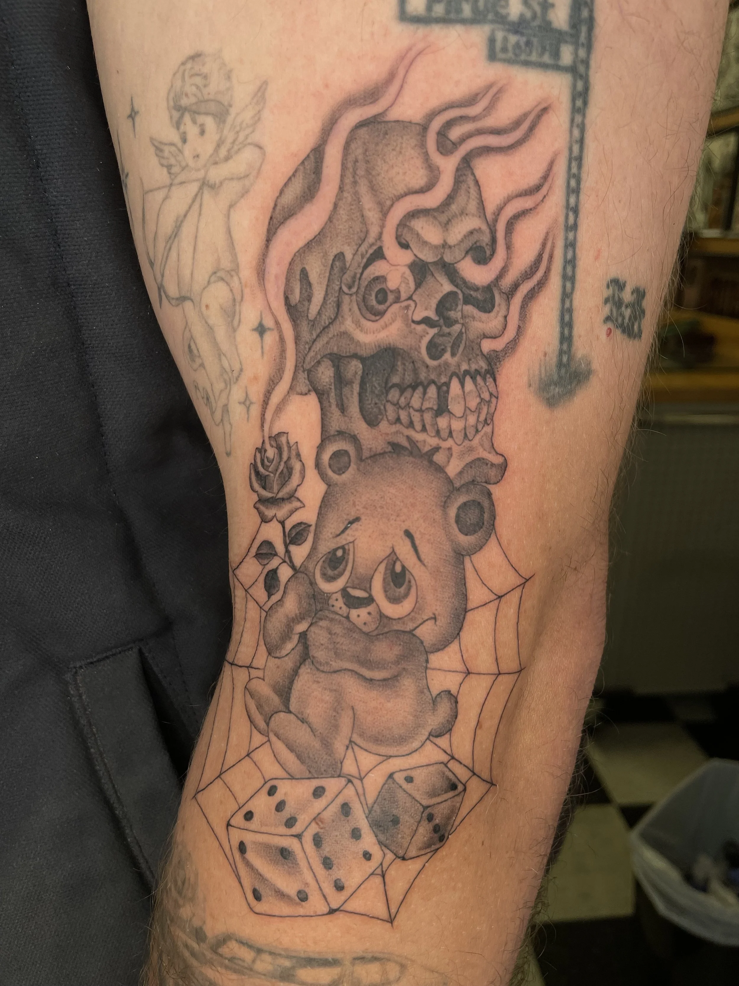 fineline skull with teddy bear and spider web tattoo.jpeg