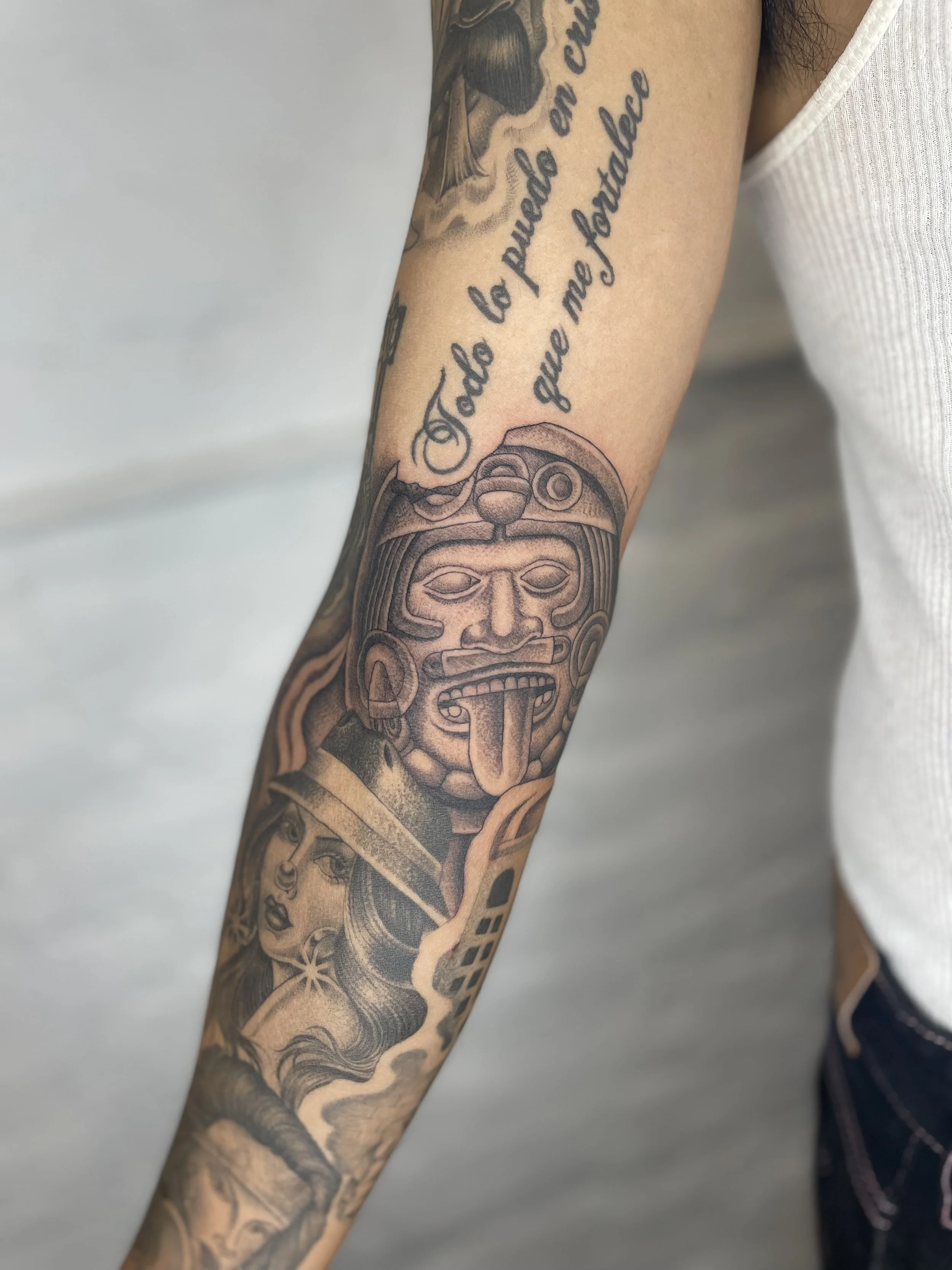fineline black and grey aztec tattoo.jpeg