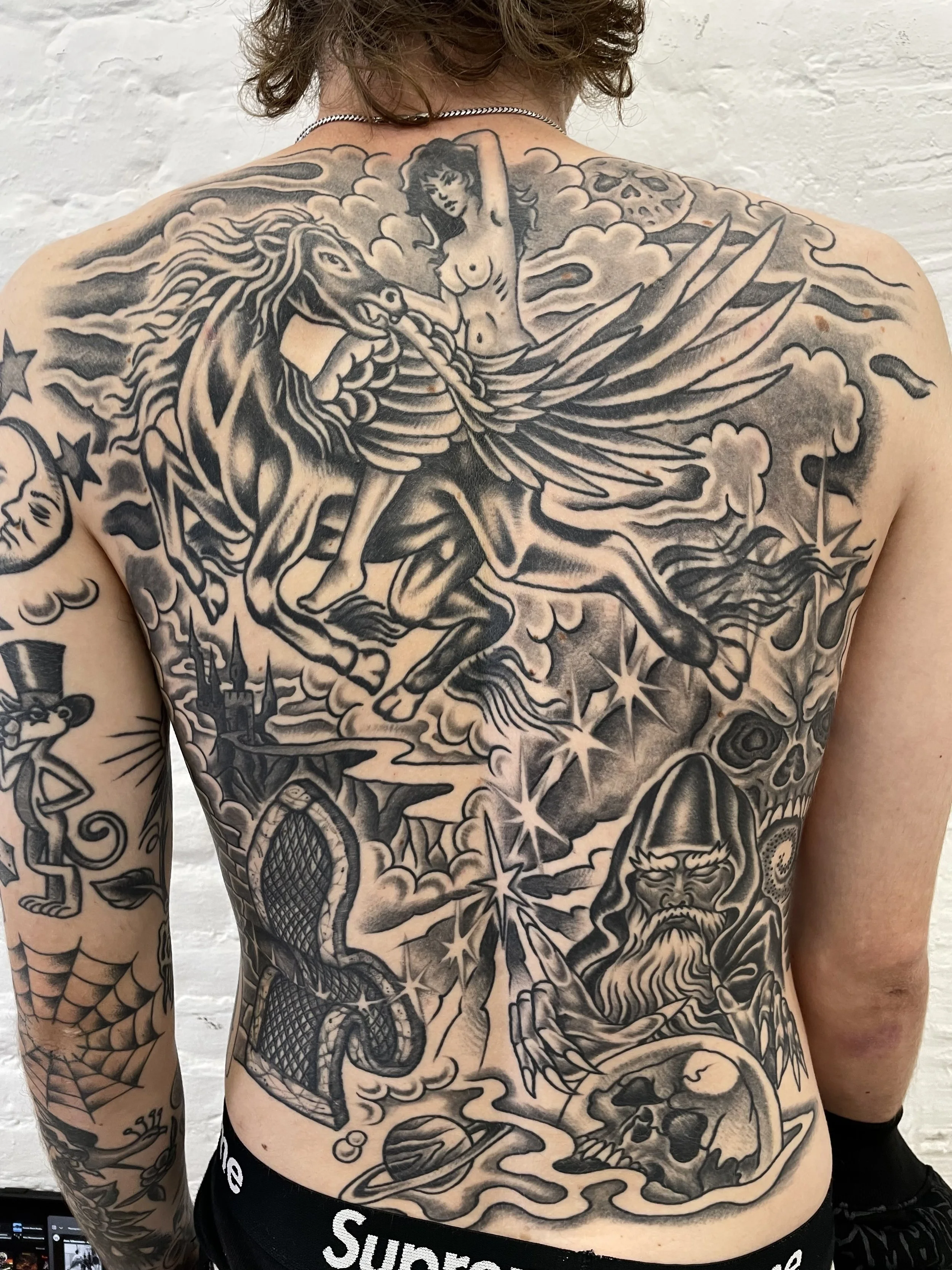 tradtional black and grey backpiece tattoo