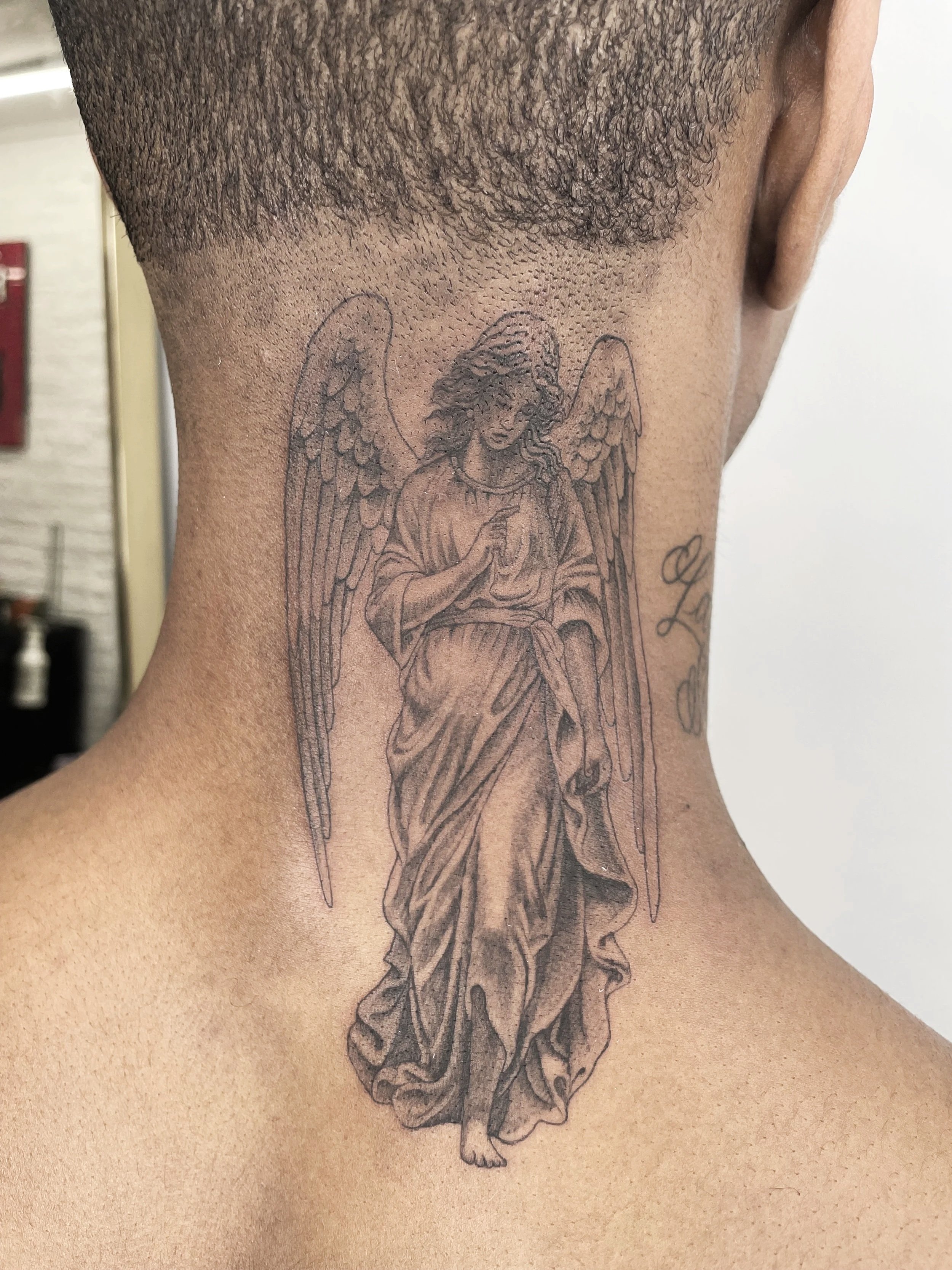 angel neck tattoo