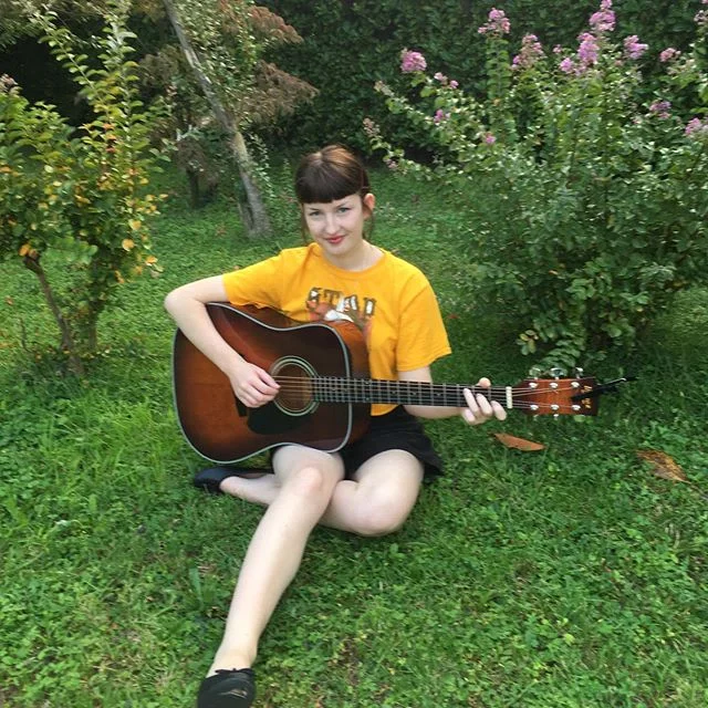Playing some tunes in the garden (yes, I know I look like a sickly Victorian child, go on, give your best white joke, I know you want to) song comes out tomorrow, so nothing can shake me!
