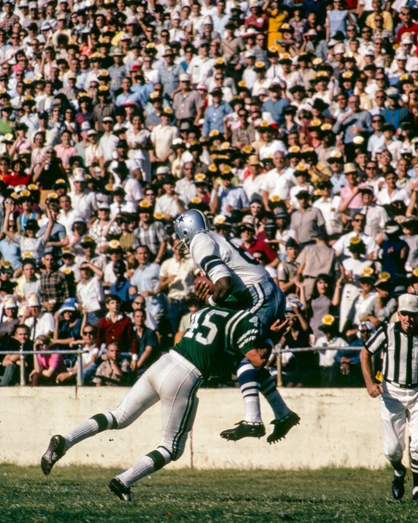 Dallas Cowboys against the Philadelphia Eagles in Dallas, Texas in the late 1960s, by Fred Maroon.

The Cowboys are wearing their home white. While most NFL teams wear (and wore) dark uniforms at home, from 1964 through the end of the 20th century th