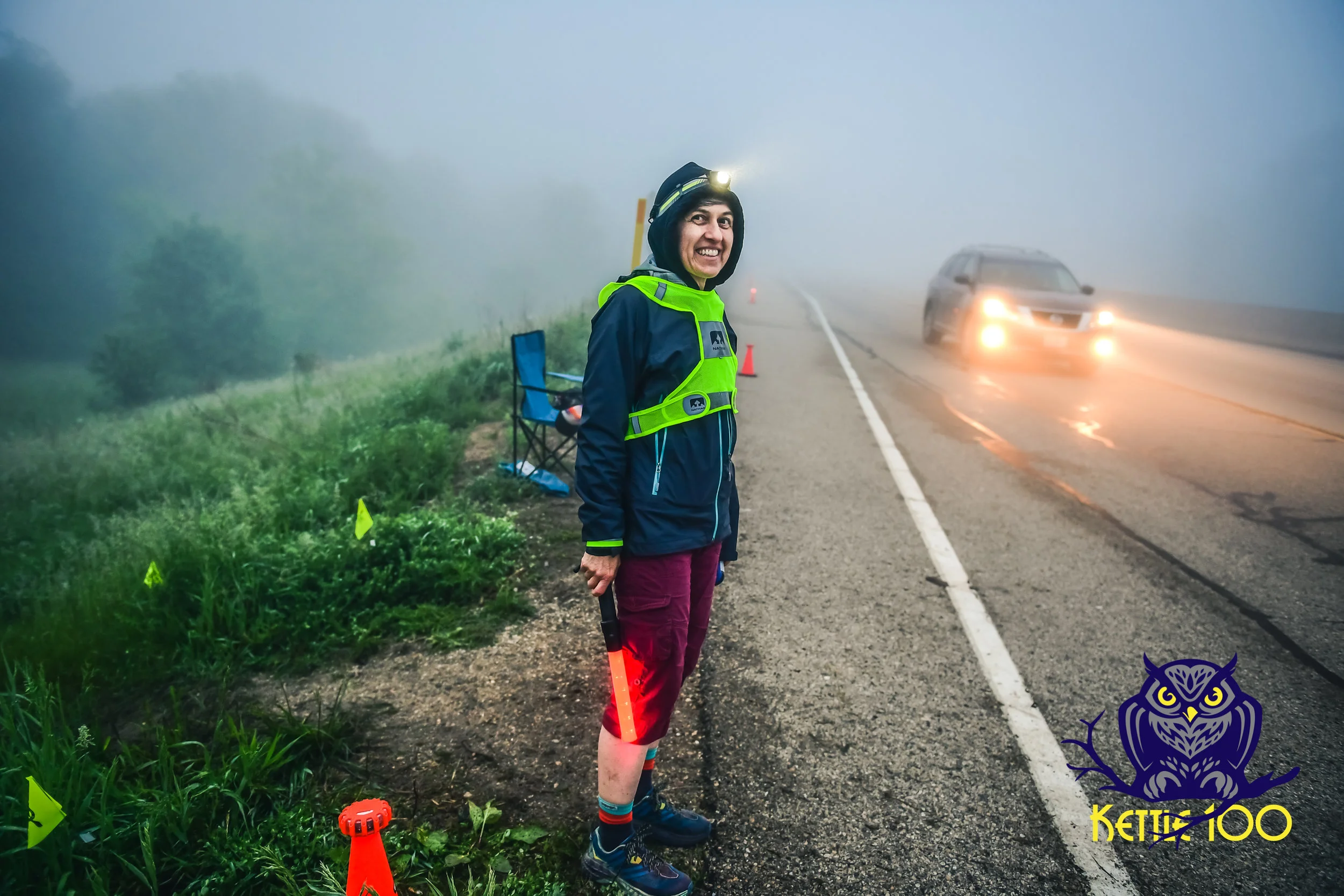 Becky Leahy helping runners cross Hwy 12 safely