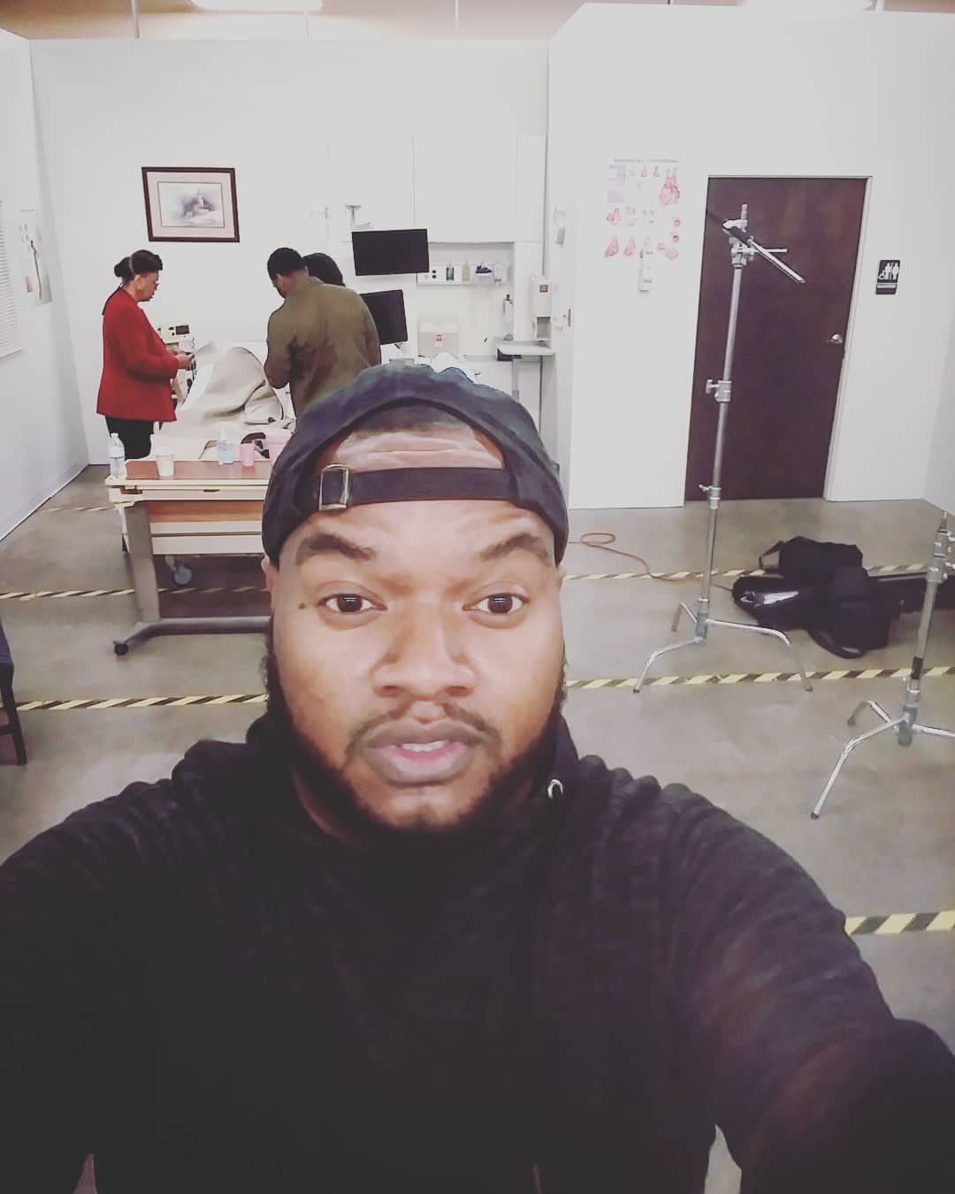 Sir Ervin stops and snaps a selfie on set