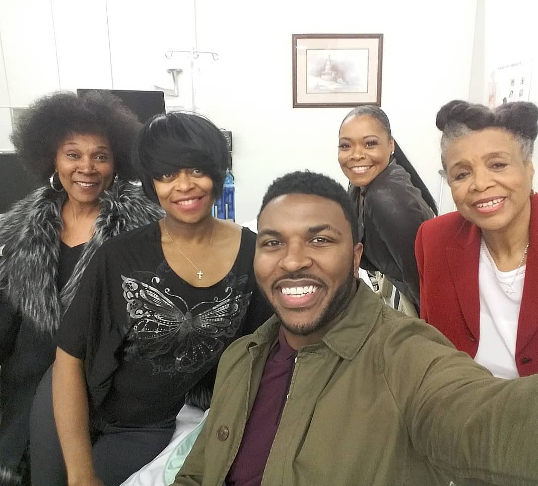 Actor Zachary Clark snaps a picture with his co-stars Relanda, Moi, Rece and Peggy