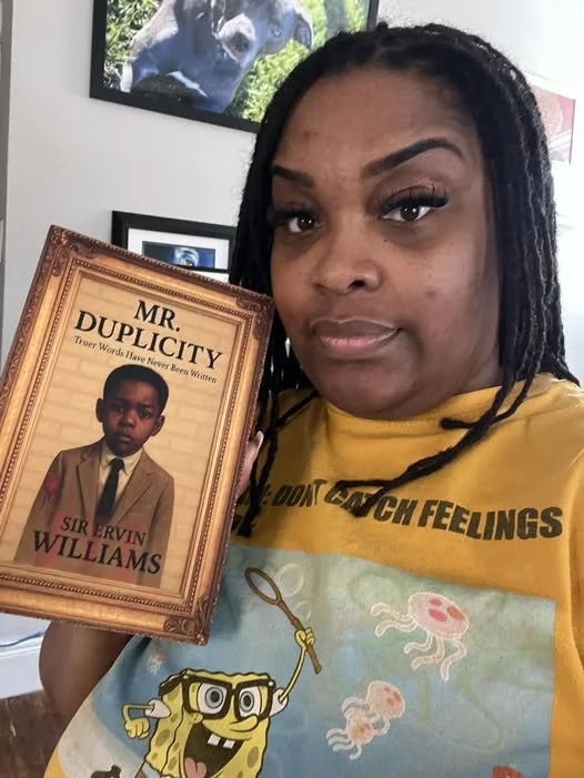 KENDRA HOLDING BOOKS.jpg