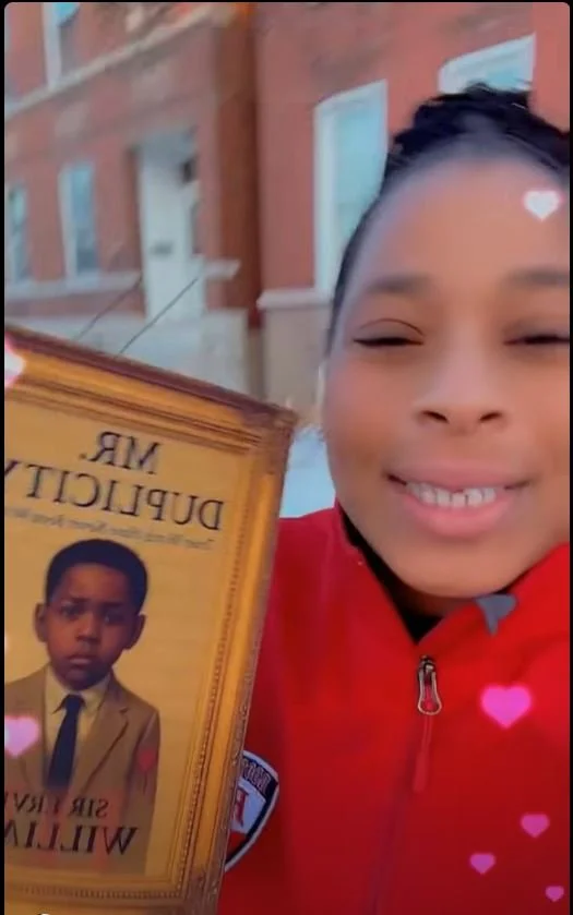 LENNETTE HOLDING BOOK.JPG