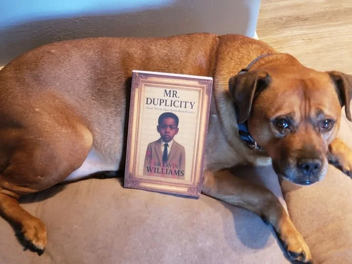 DOG HOLDING BOOK.jpg