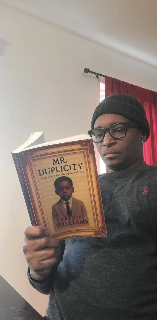 keith holding book.jpg