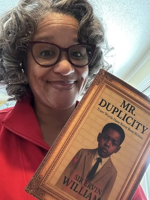 Ms. Clark holding book.jpg