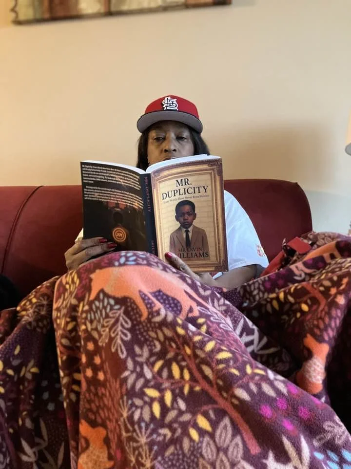 mary aziz holding book.jpg