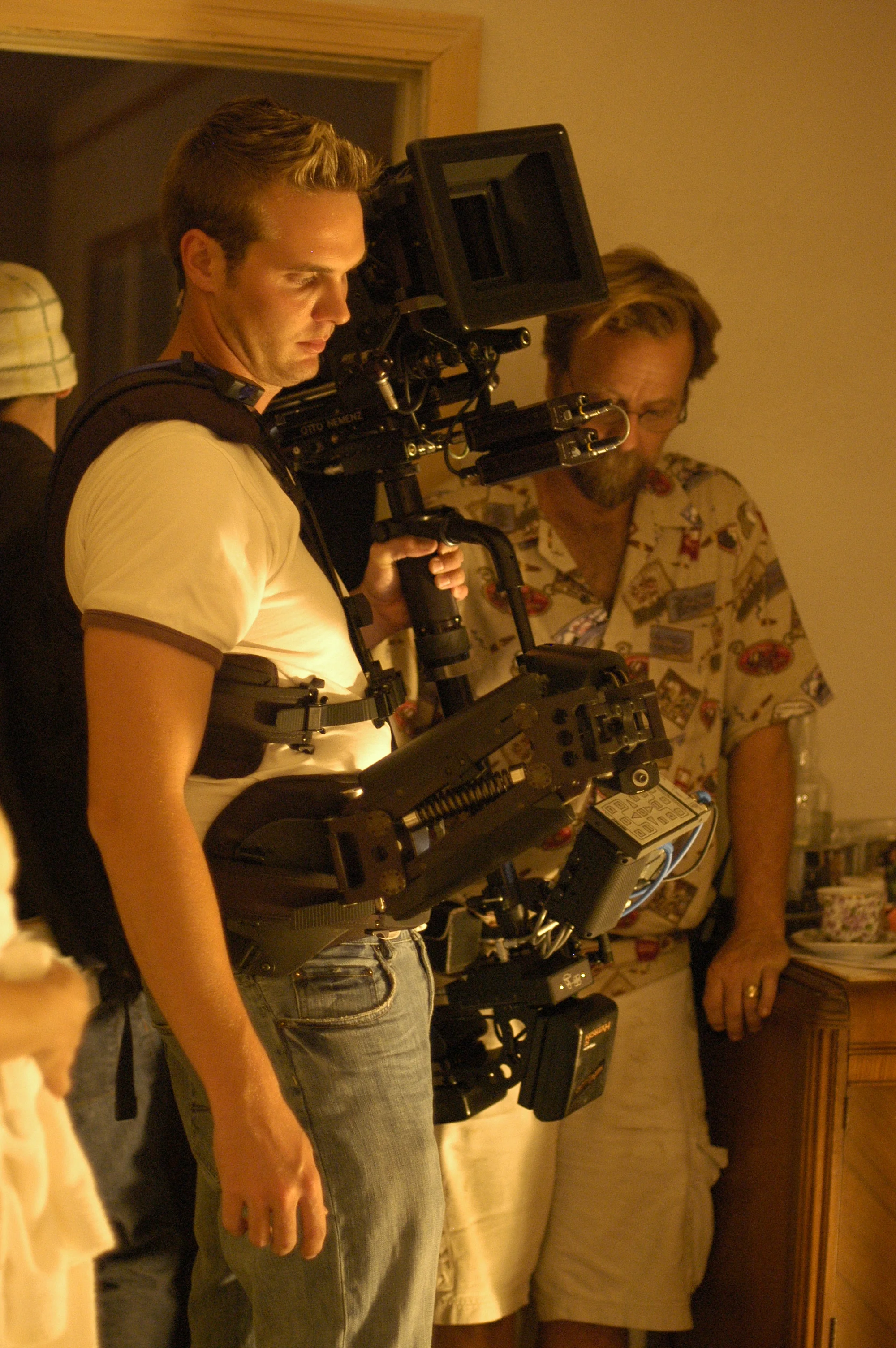  Camera operator Dave Ortkiese discusses a shot with gaffer John Luker. 