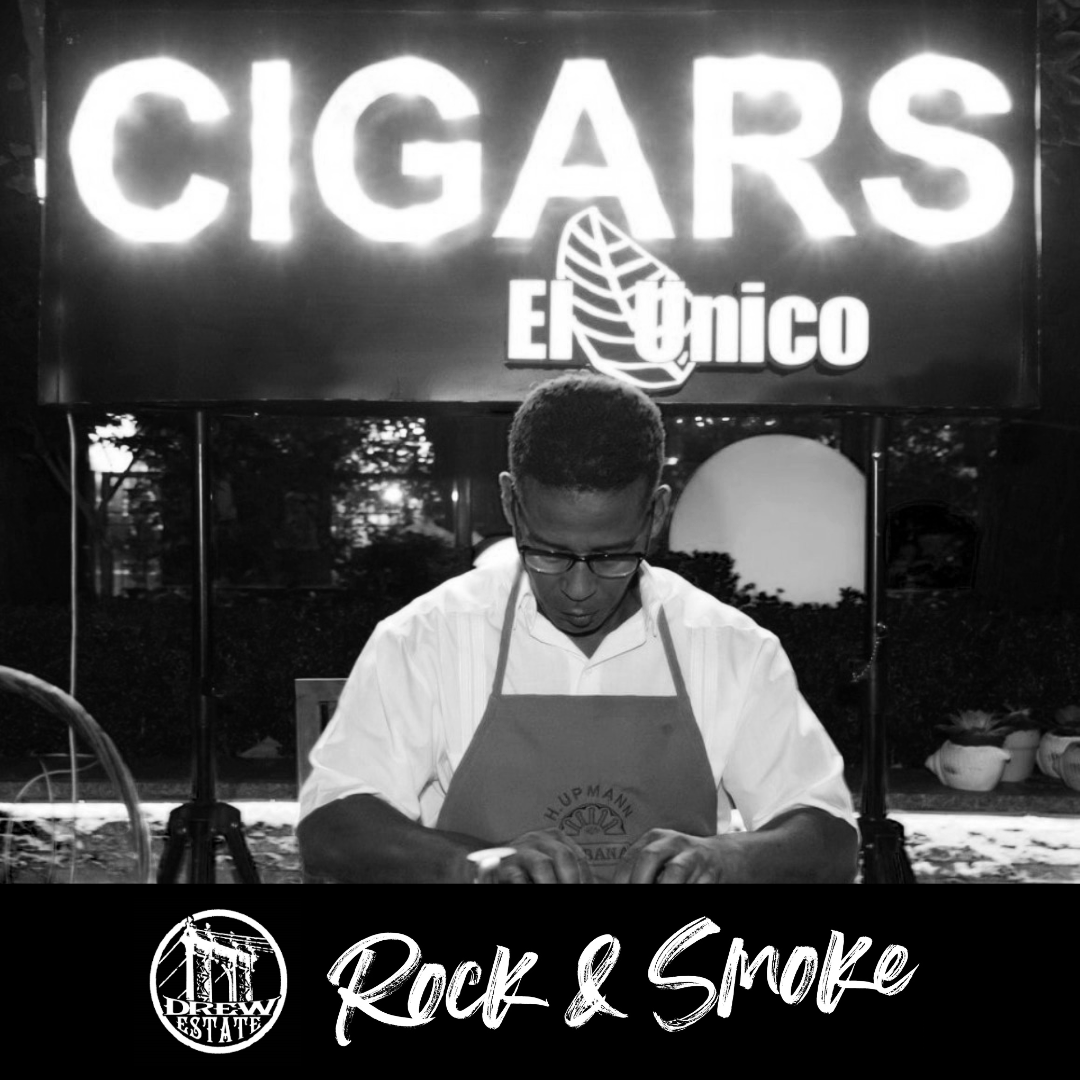 Man rolling cigars at El Unico Cigars