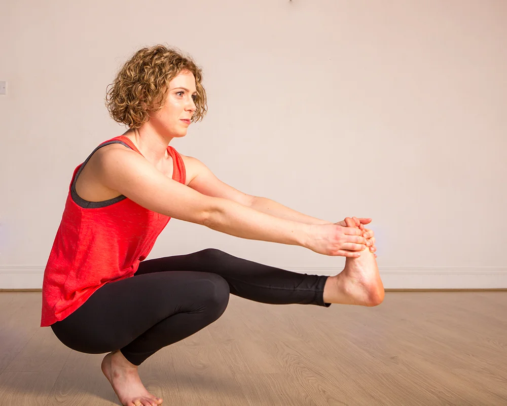 Janine practices a pistol squat