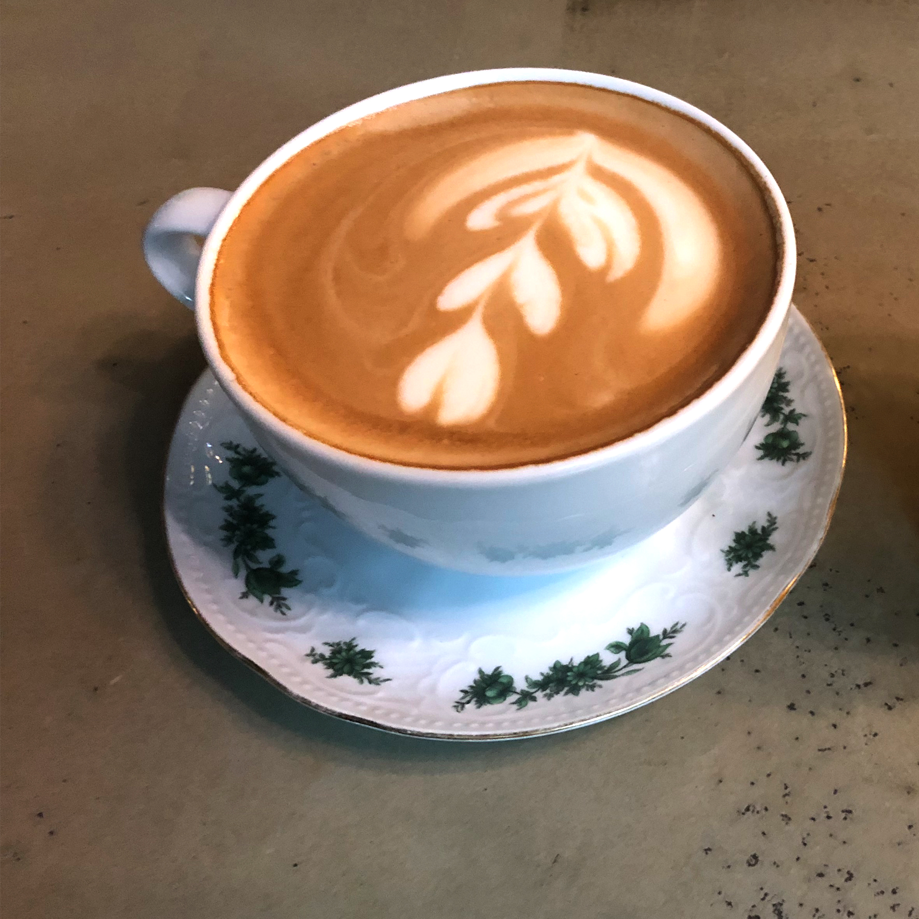 A perfect latte in a perfect little teacup