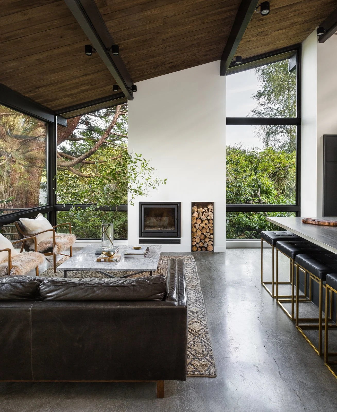 a-new-double-height-fireplace-column-is-the-focal-point-of-the-new-living-room-and-underscores-the-rooms-graceful-proportions