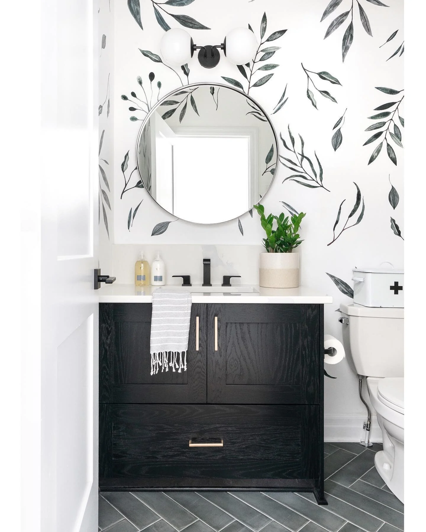 Botanical decals were all that was needed to elevate this simple bathroom.