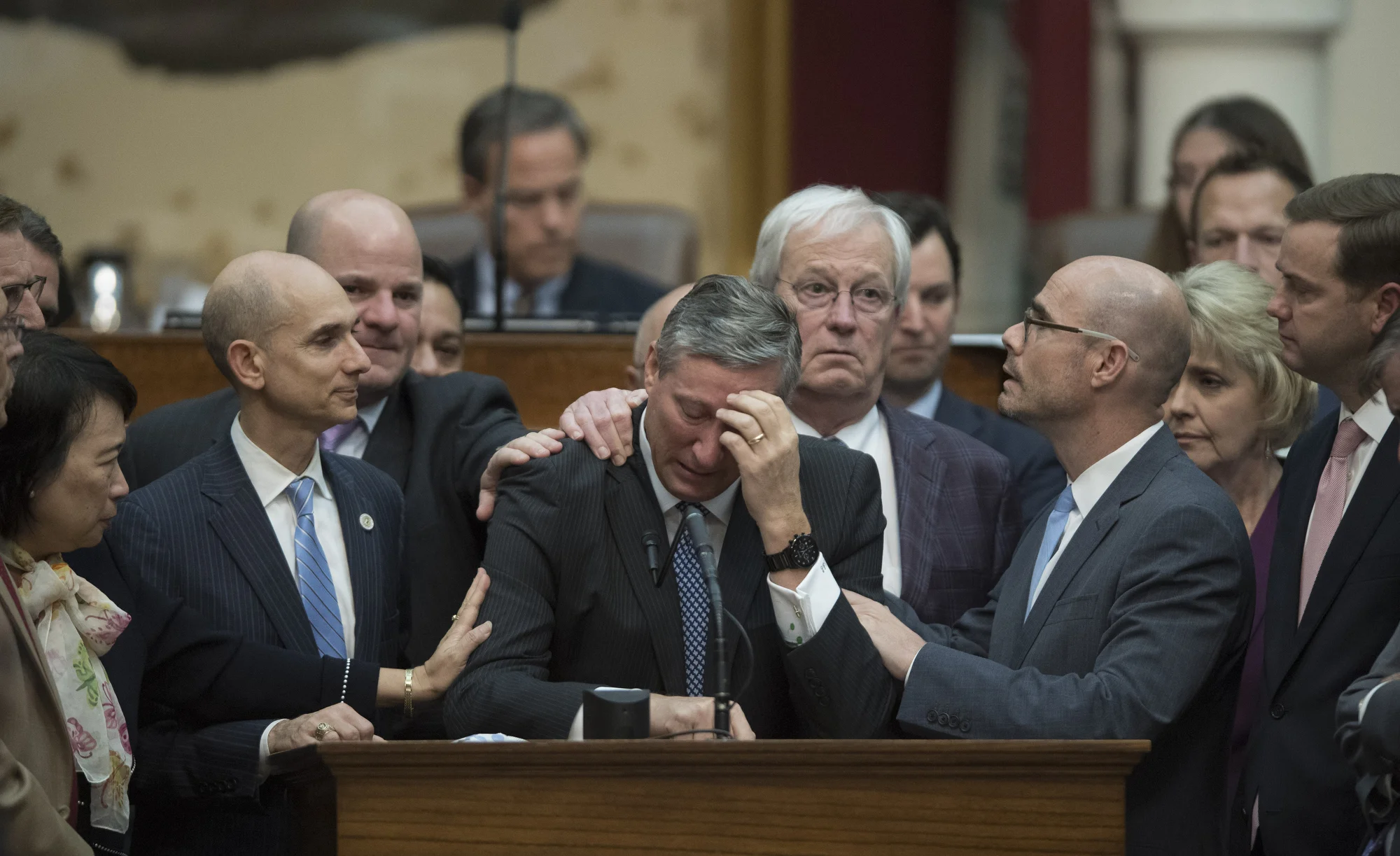 State Rep. Drew Springer comforted