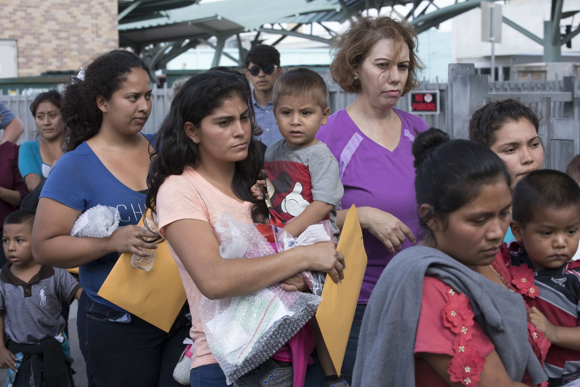 Immigrant families await help, McAllen, Texas