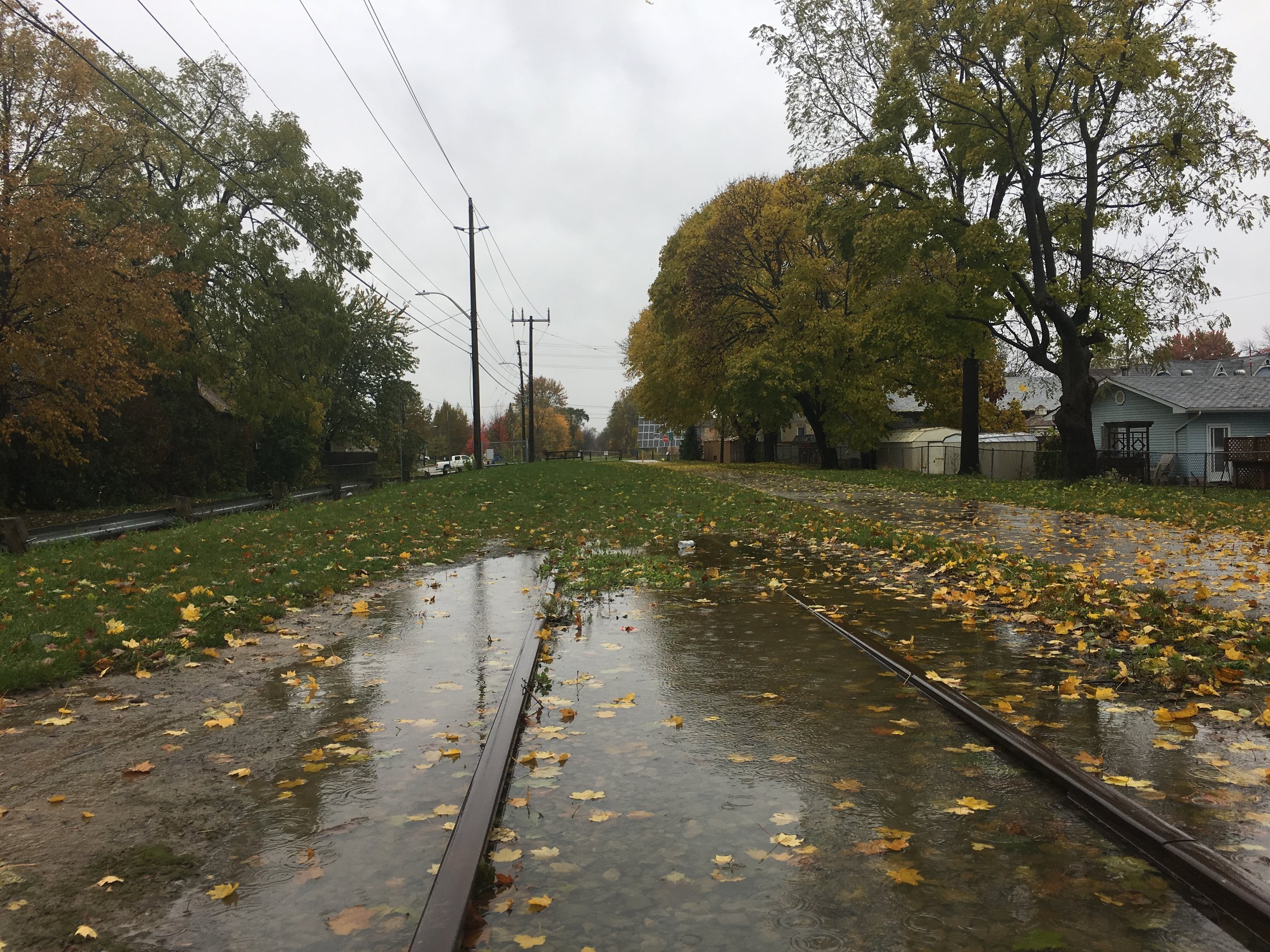 Currently, there is a section of track missing in the London & Port Stanley Terminal Railway line. The photo above highlights the southern point of the missing section, just south of Kains Street in St. Thomas. In 2017, the City of St. Thomas received funding from the federal government to complete the track, part of the ‘Canada 150’ program, but the project has been delayed, apparently the result of setbacks in negotiations with CN Railway.
