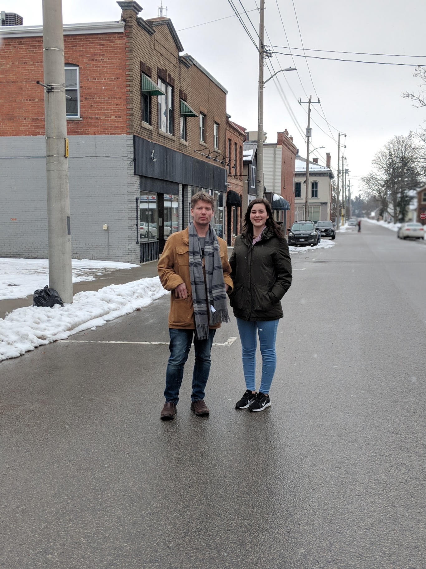 In the first photo, Jenn and Maddie stand on Dundas Place in London around the holidays, just after the flex-street opened up following construction. Notice the absence of curbs. In the second photo, Andrew and Emily stand on Kent Street in Simcoe. Perhaps this area in downtown Simcoe could be transformed into a flex-street, too.
