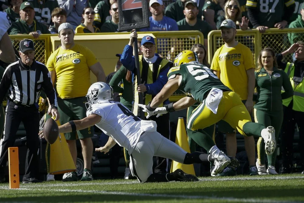 Derek Carr’s fumble opens floodgates for Rodgers’ 6-TD day