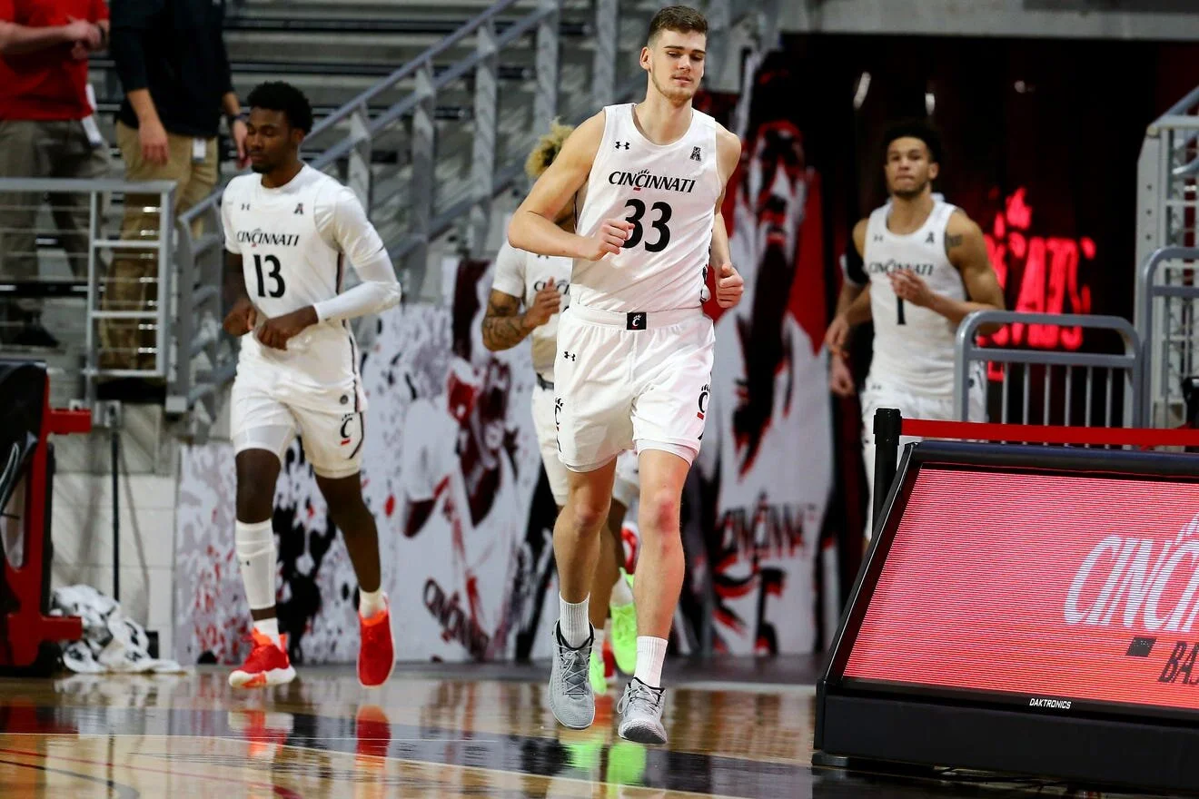 UC senior Chris Vogt embracing mentor role with younger teammates during turbulent season