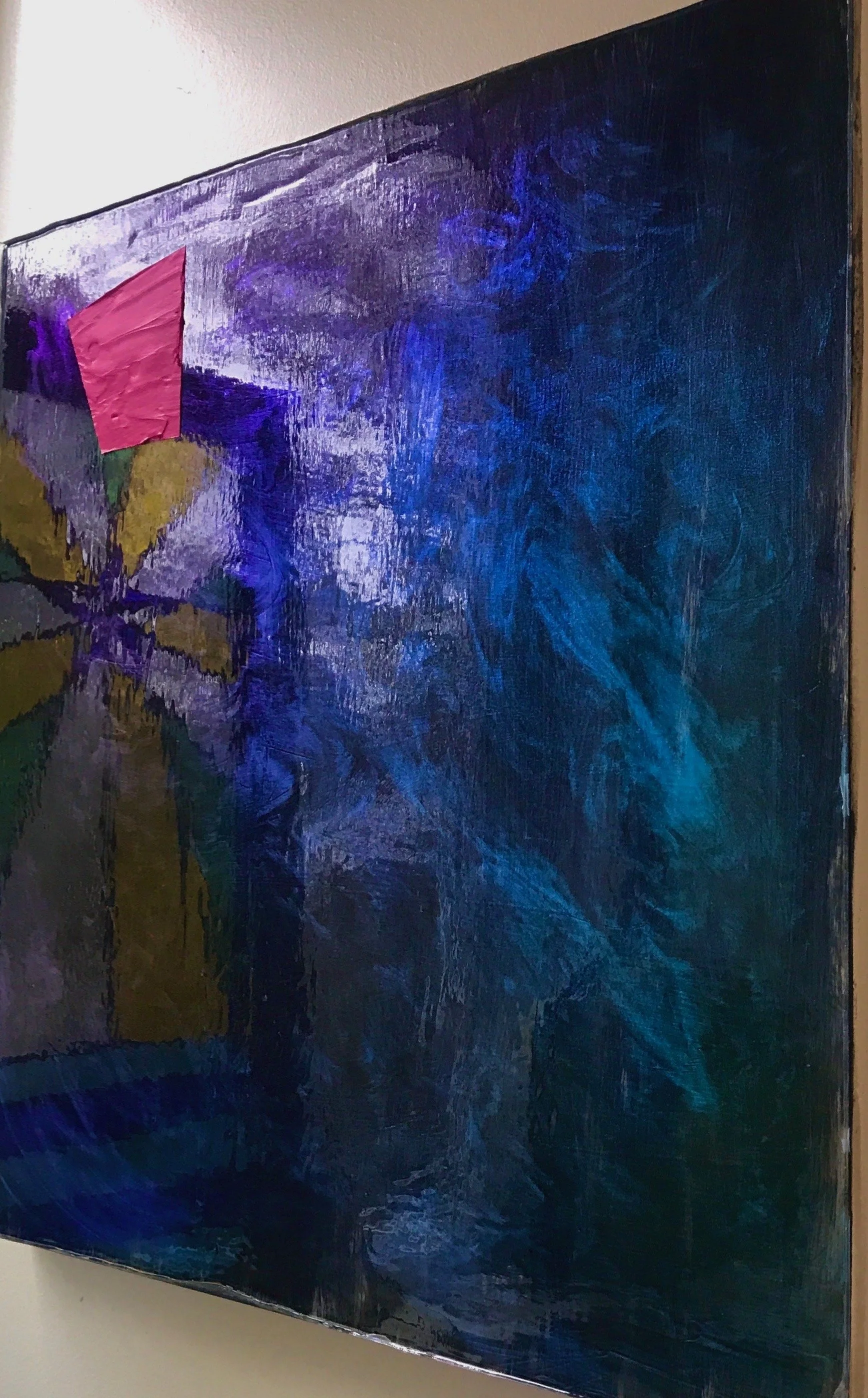 (skewed angle with stained-glass reflection)